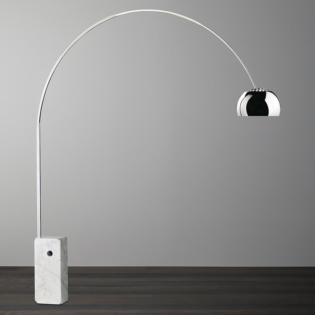 A close studio shot of the Clérachic arc lamp's dimpled chrome dome, showing the texture of its polished surface.