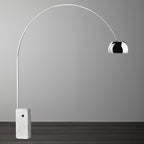 A close studio shot of the Clérachic arc lamp's dimpled chrome dome, showing the texture of its polished surface.