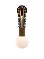 Clérachic wall light with blue-grey speckled stone beads on a brass frame and a brass-wrapped base, on a plain background.