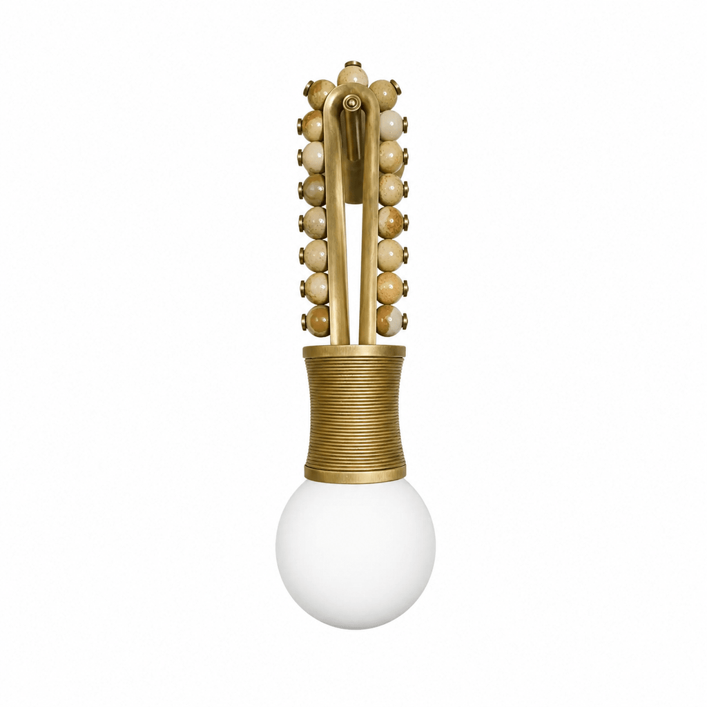 Clérachic wall light with tan stone beads on a brass frame and a brass-wrapped socket base, shown alone on white.