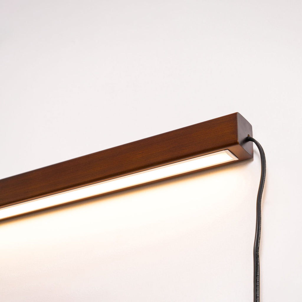 Slim wood wall light with clean bright illumination