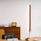 Round wood wall light glowing in a cozy interior corner