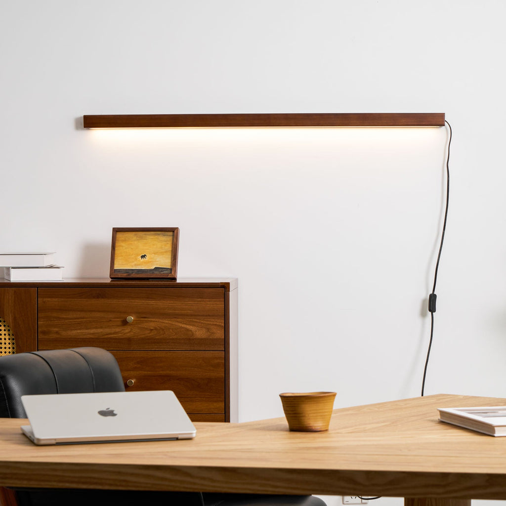 Pine wood disc wall light shown against a neutral backdrop