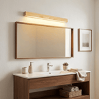 Slim linear wood wall light studio shot against white