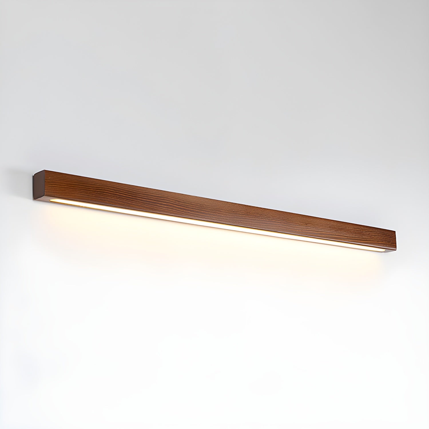 Natural pine linear wall light glowing in a hallway