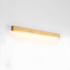 Slim pine wood wall sconce casting even downward light