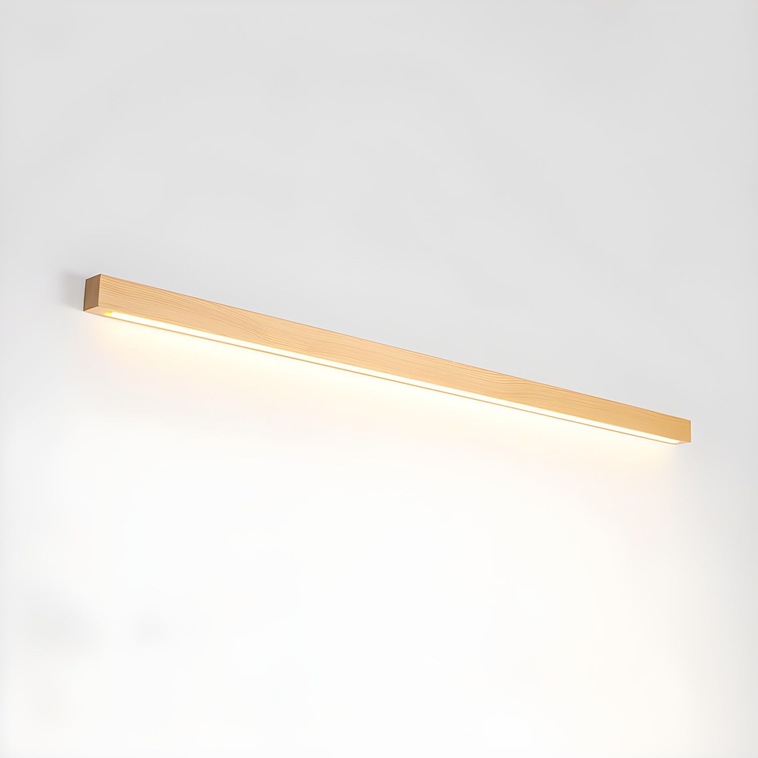 Linear wood wall light mounted near a mirror