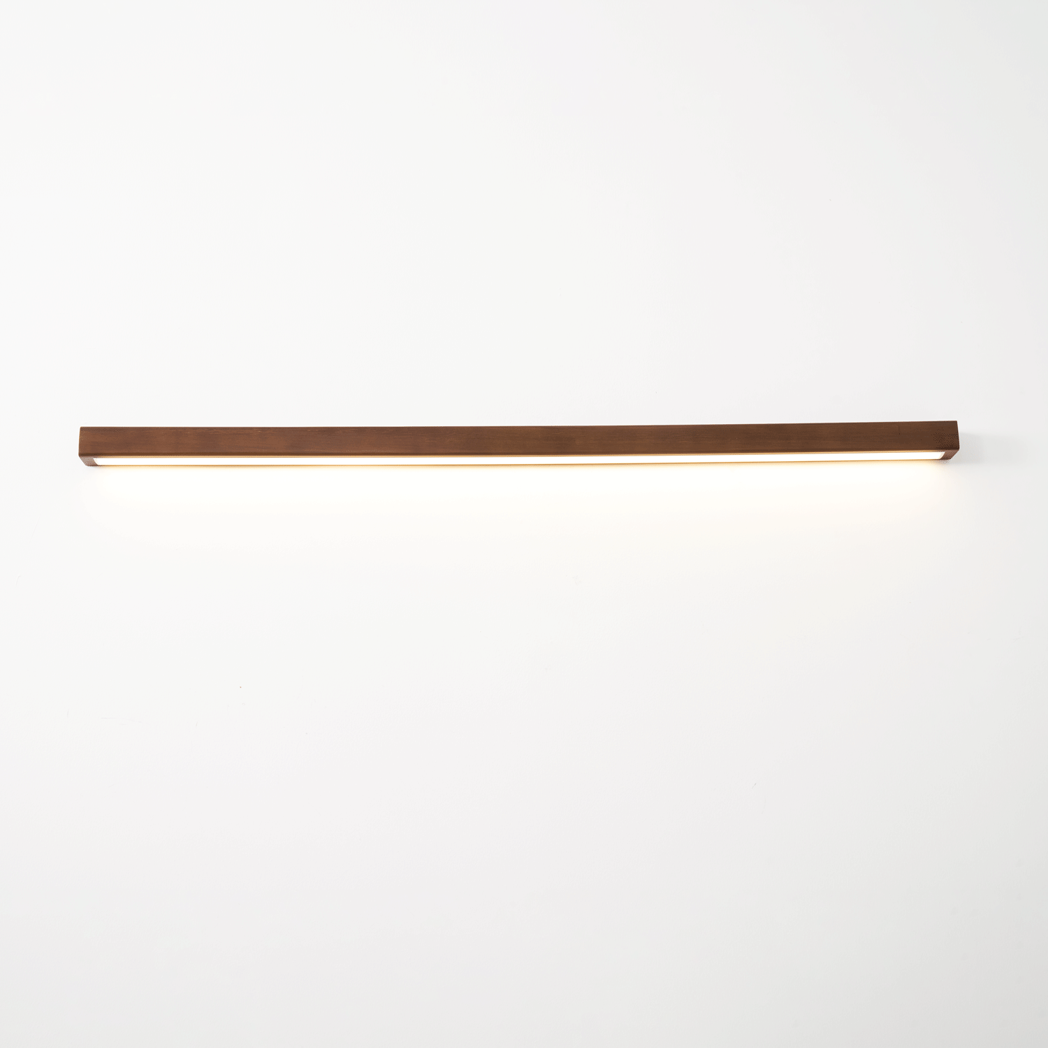 Pine wood wall light illuminating an entryway softly