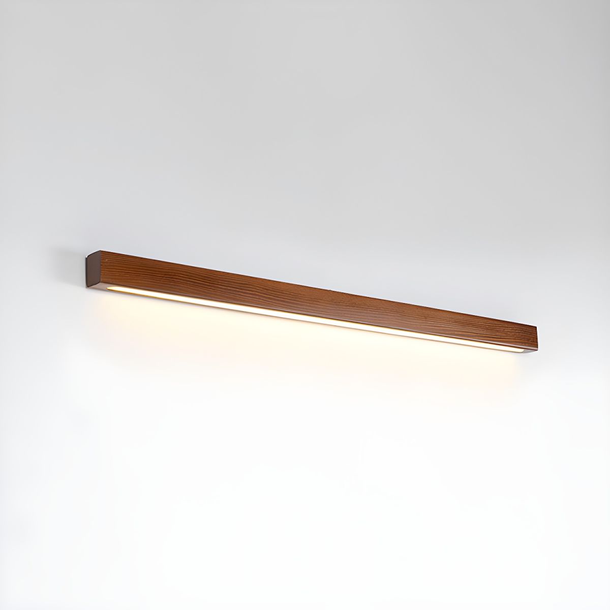 Linear wooden wall sconce shown in a styled interior