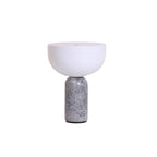 Clérachic's sphere table lamp with a grey marble base and white dome shade, photographed on plain white.