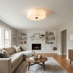 Vintage-style ceiling light with metal frame on plain background