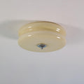 Art Deco ceiling light with ribbed glass shade glowing warm
