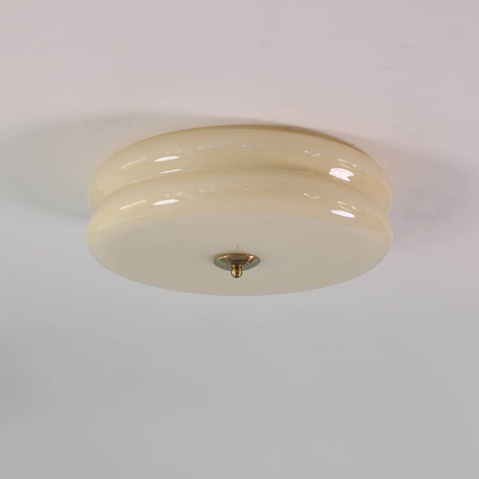 Art Deco ceiling light shown against a soft interior backdrop