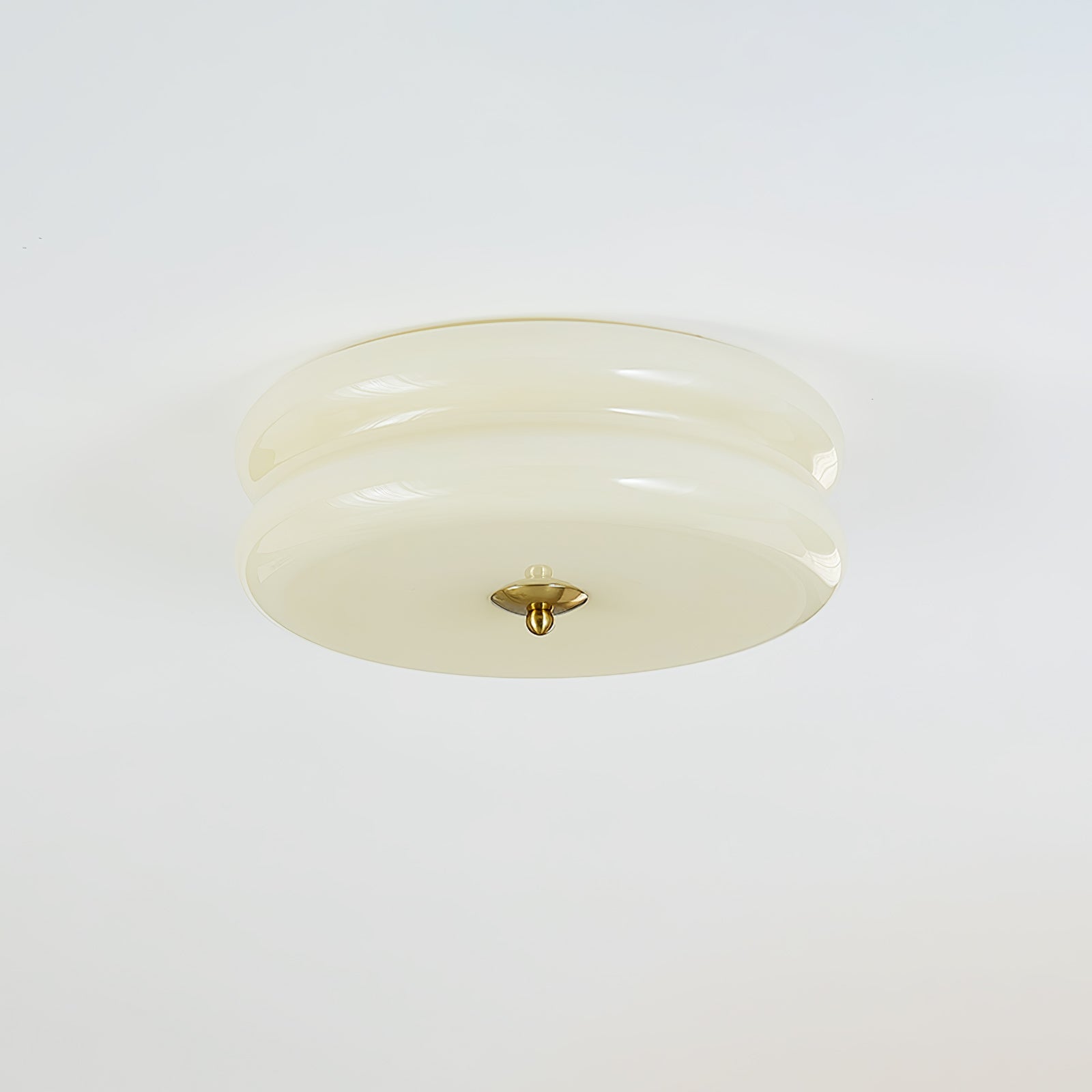 Ribbed glass ceiling light mounted flush in a furnished room