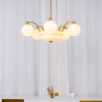 Art Deco chandelier five-head layout lit with warm bulbs