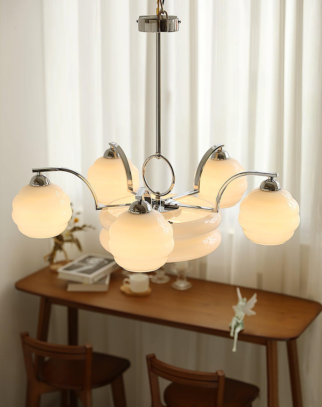 Art Deco chandelier detail of glass shade and metal arm