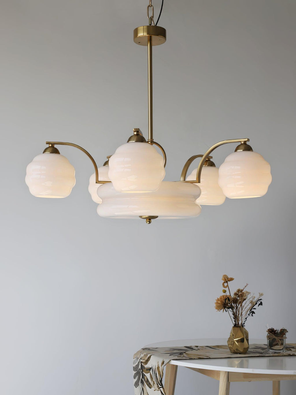 Art Deco chandelier viewed from below with lit glass shades