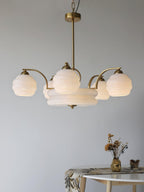 Art Deco chandelier viewed from below with lit glass shades