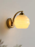 Art Deco wall sconce with curved glass shade detail