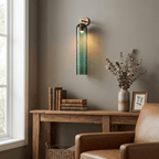 Mouthblown glass wall sconce with slim metal hardware detail