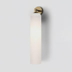 Mouthblown art glass sconce mounted on a wall, downward orientation