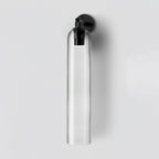 Cylindrical glass wall light with metal base, close detail view