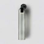 Wall sconce with cylindrical mouthblown glass shade and metal base