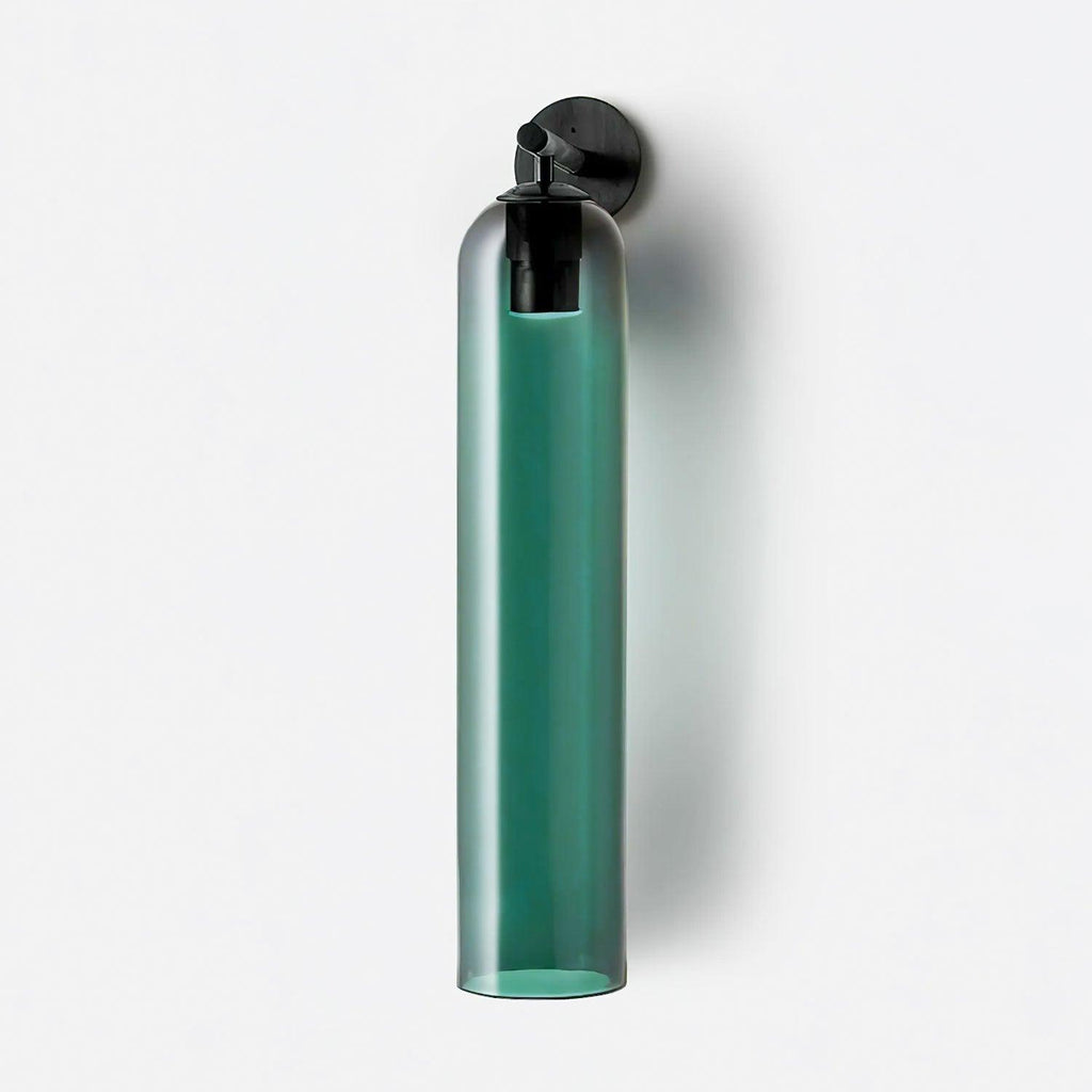 Glass wall sconce mounted vertically, soft ambient glow on wall