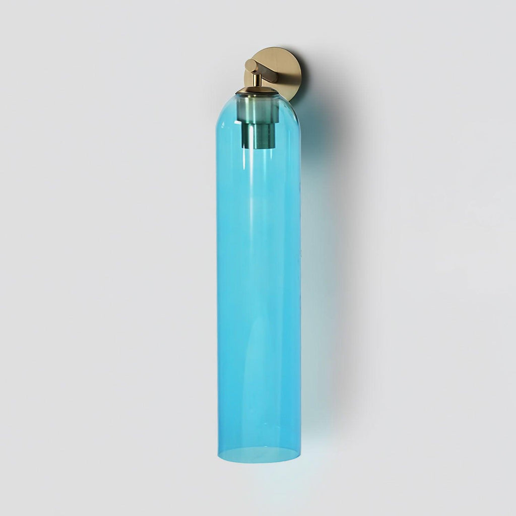 Glass wall sconce illuminated in a softly lit interior setting