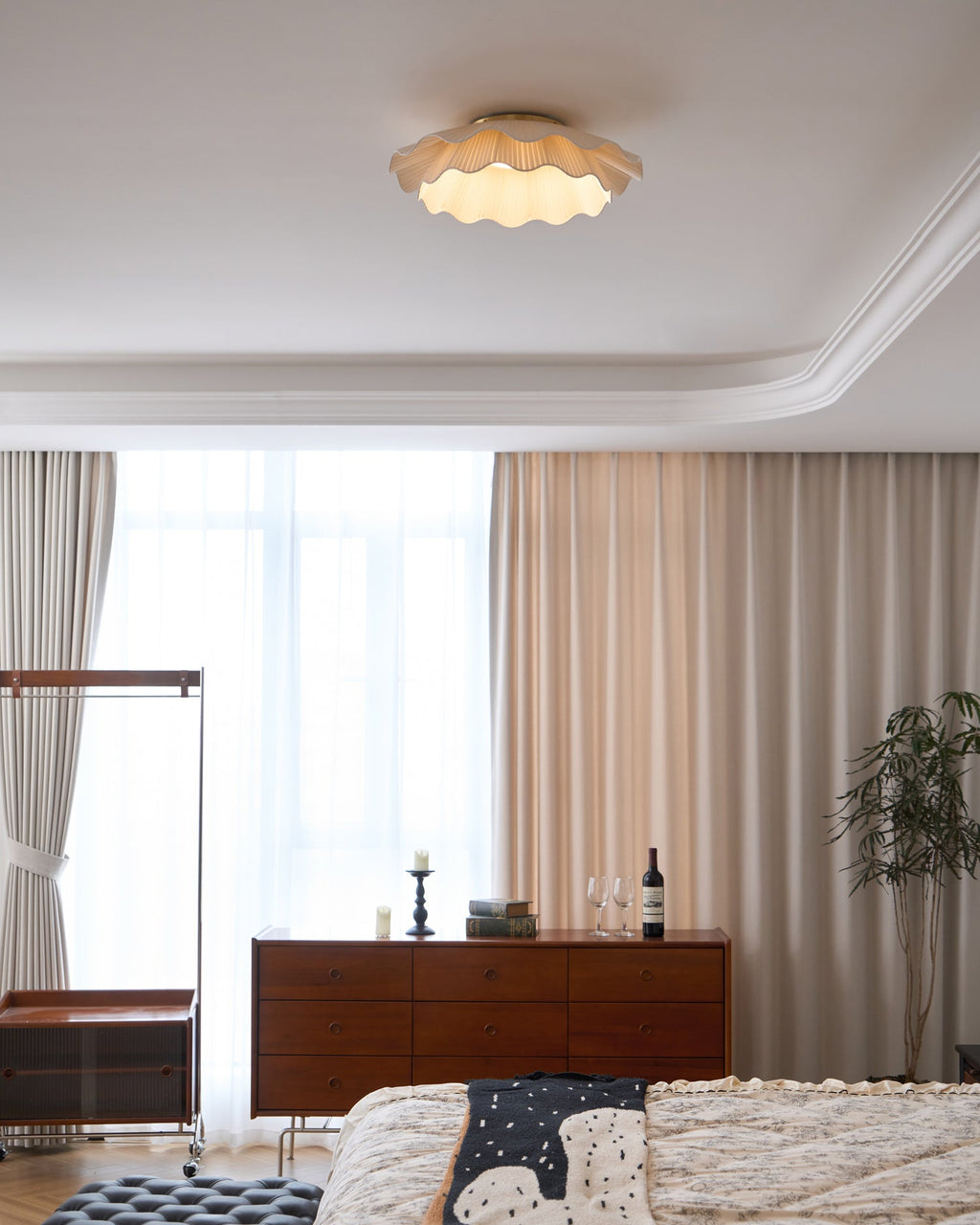 Pleated wave fabric ceiling light mounted above a room