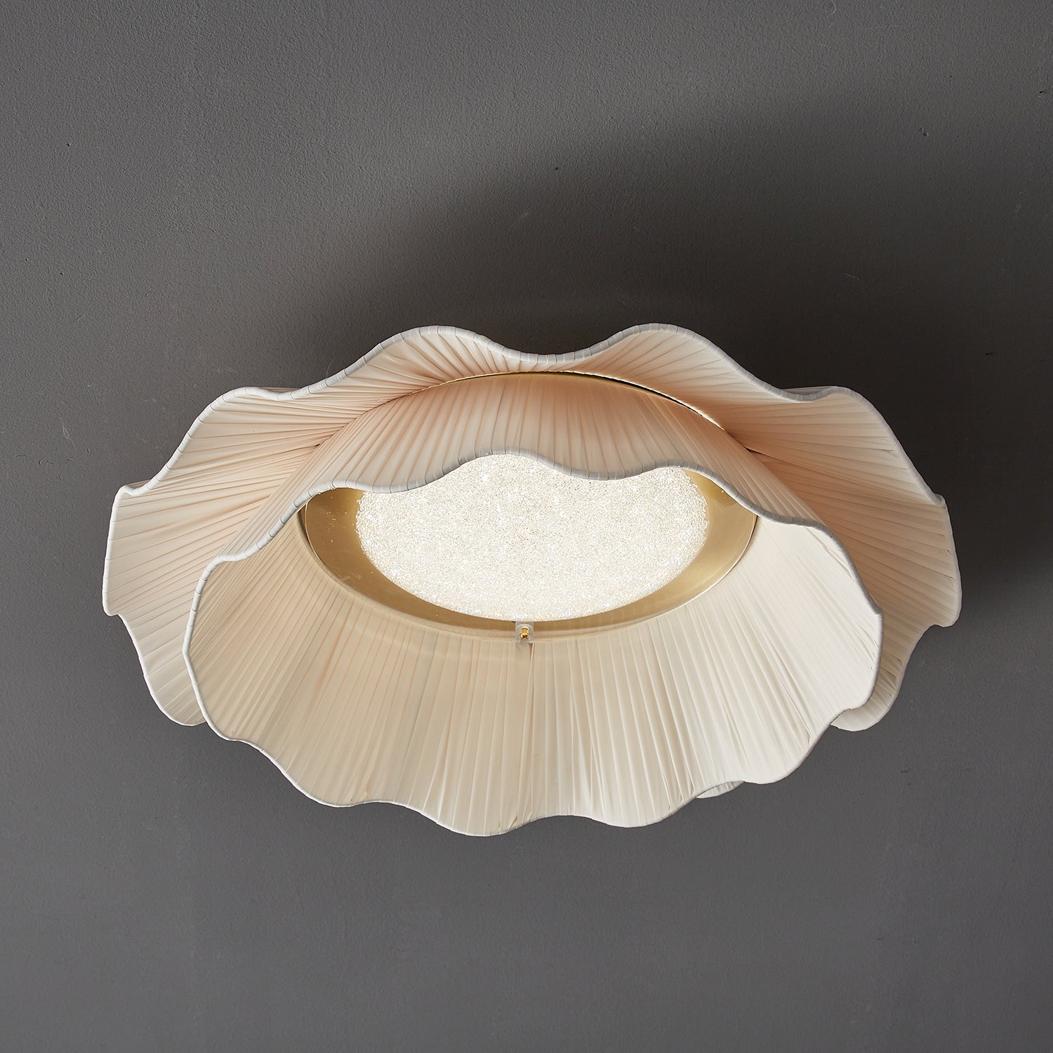 Pleated wave fabric ceiling light viewed from the side
