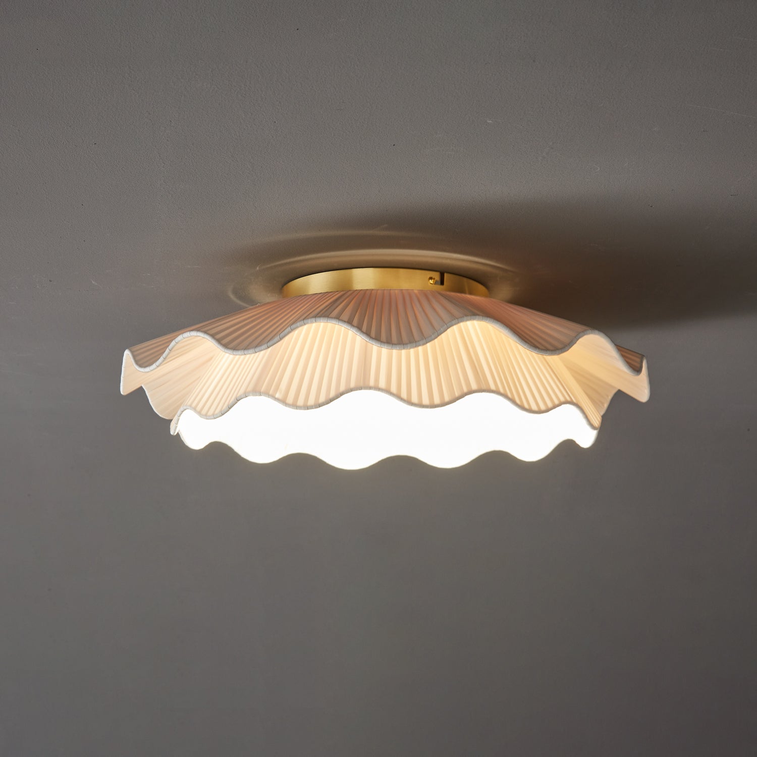 Pleated wave fabric ceiling light detail of pleated folds