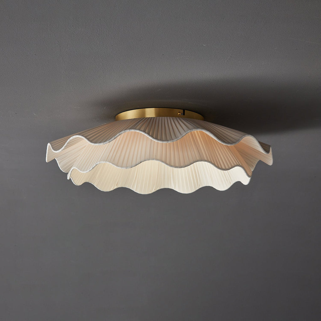Pleated wave fabric ceiling light with brass and beige finish