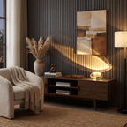 Smooth crystal oval table lamp lit warmly against dark background
