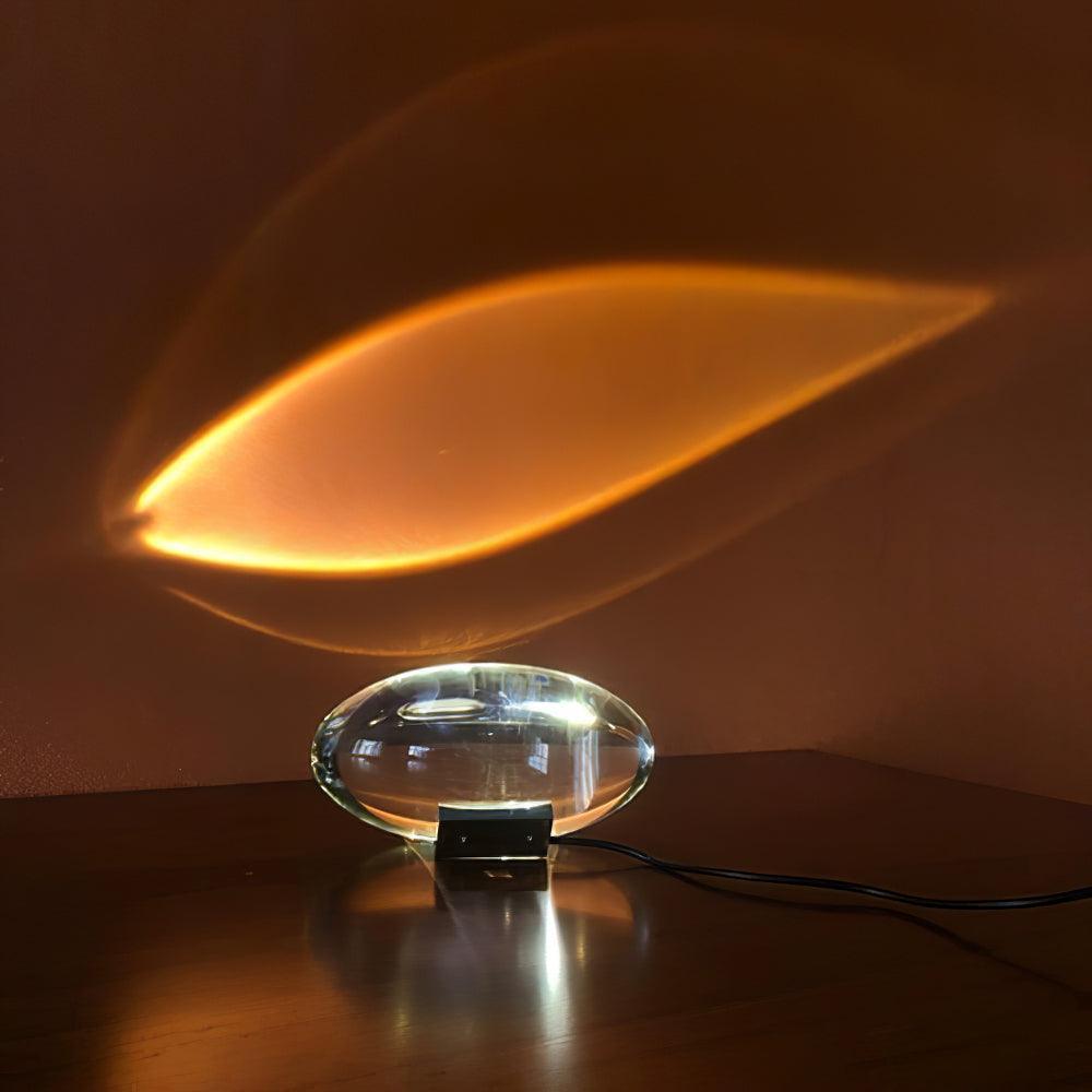 Sculptural crystal glass table lamp with warm glow and chrome foot
