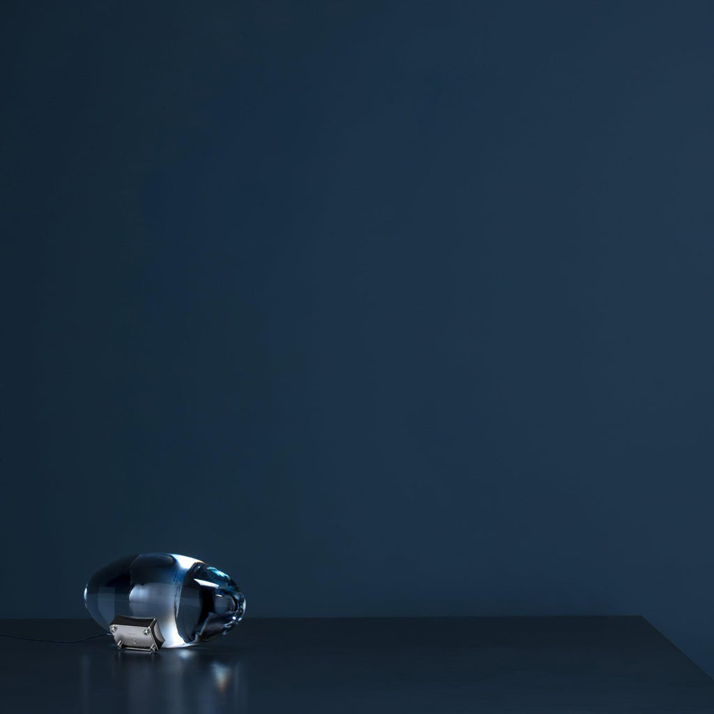 Crystal glass table lamp detail showing oval shade and chrome base