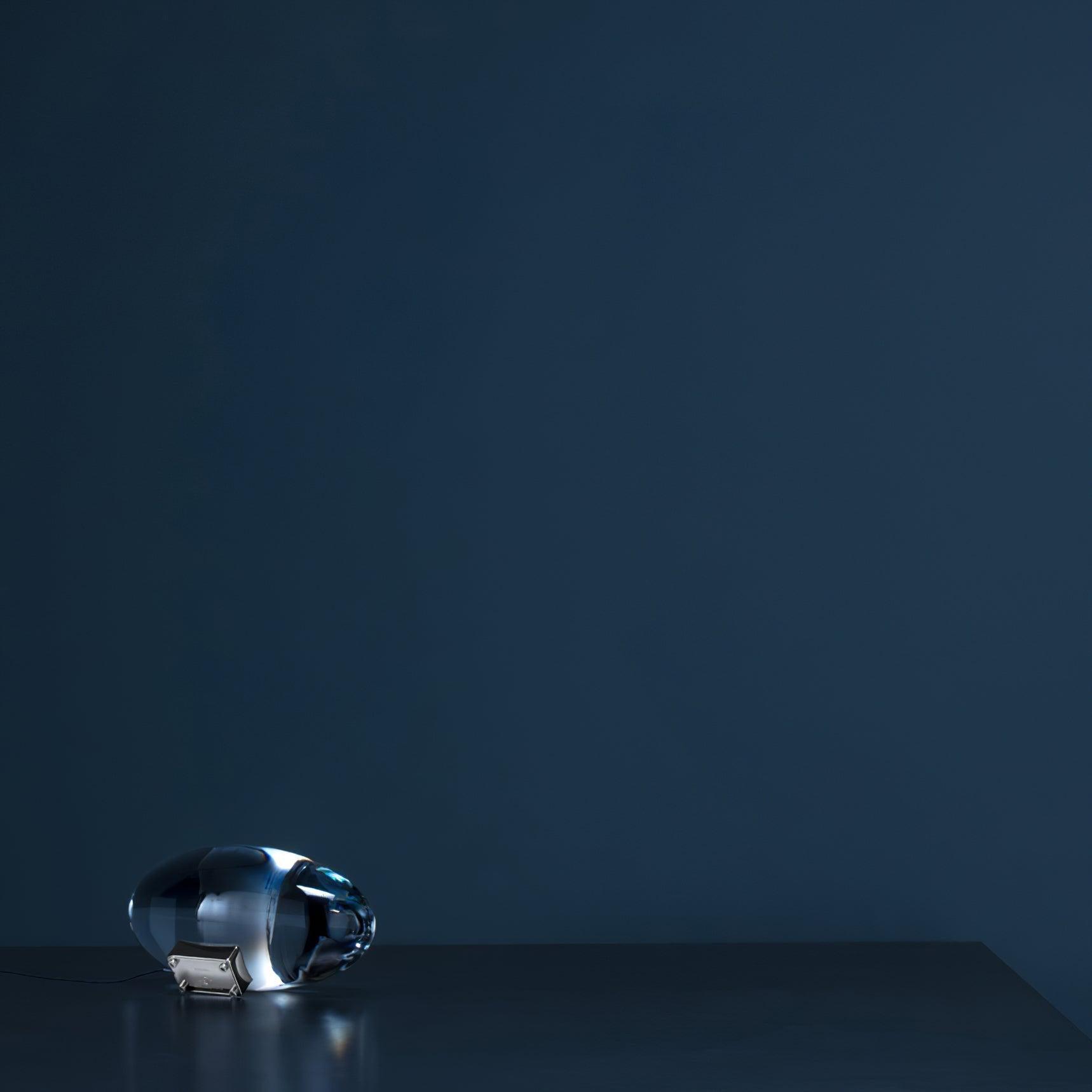 Crystal glass table lamp detail showing oval shade and chrome base