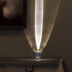 Crystal oval table lamp glowing softly beside a bedside book