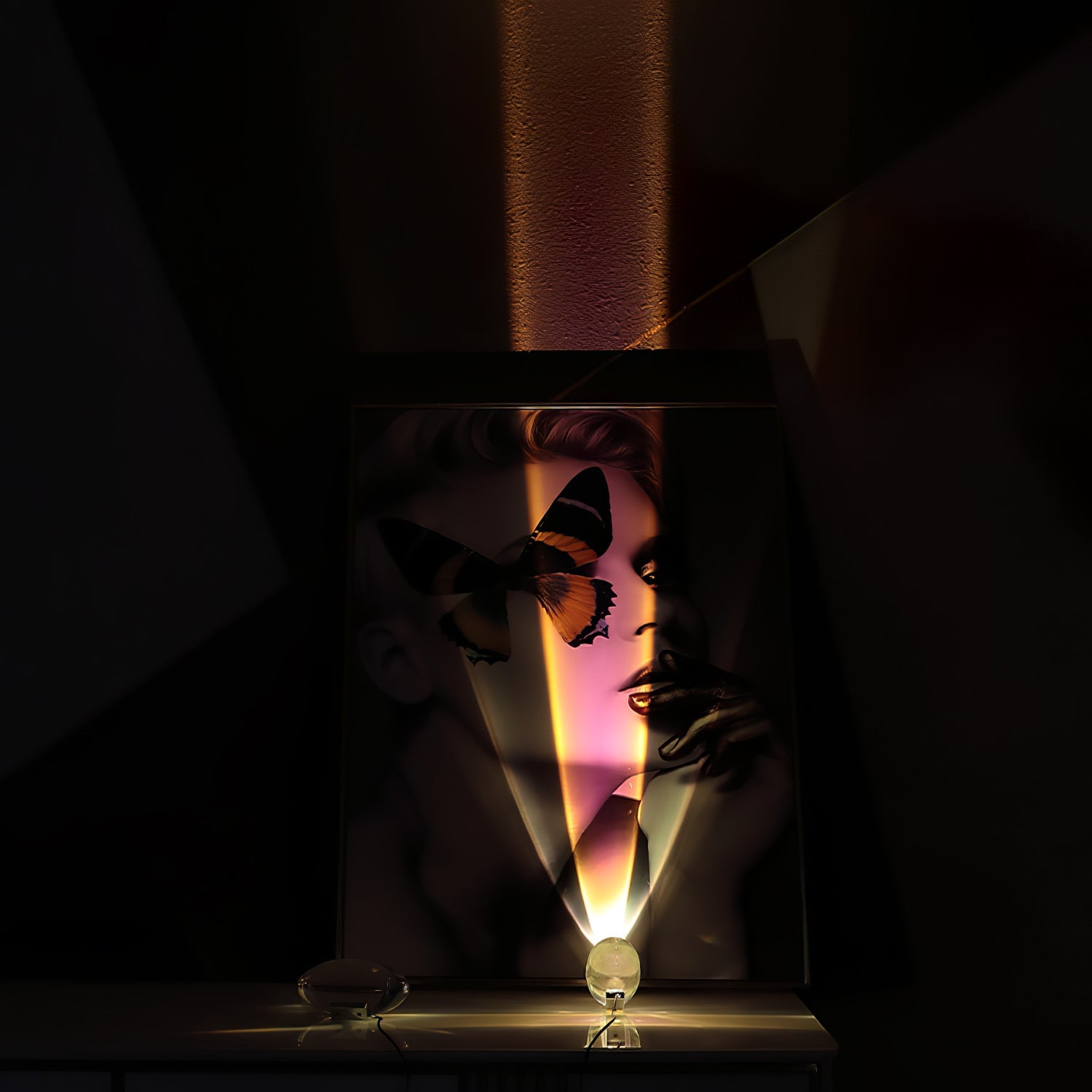 Crystal glass oval table lamp lit warmly beside soft furnishings