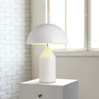 Sculptural metal table lamp in a warm interior setting