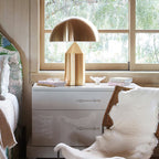 Sculptural metal table lamp styled on a console surface