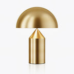 Sculptural metal table lamp in a warm copper finish