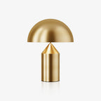 Sculptural metal table lamp with smooth rounded shade
