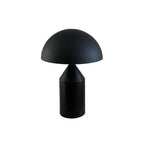 Sculptural metal table lamp viewed from the side