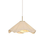 Studio side view of this beige Clérachic pendant light, its scalloped fabric edges shown in full profile.