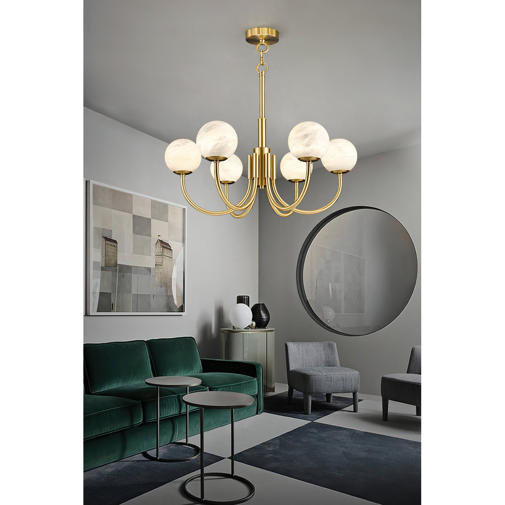 Clérachic hung in a living room with a deep green velvet sofa, round black mirror and framed print