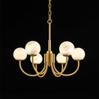 Clérachic compact studio shot on black with the alabaster globes unlit, showing their matte stone surface