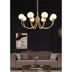 Clérachic lit above a taupe sofa against a black panelled wall with a framed poster alongside