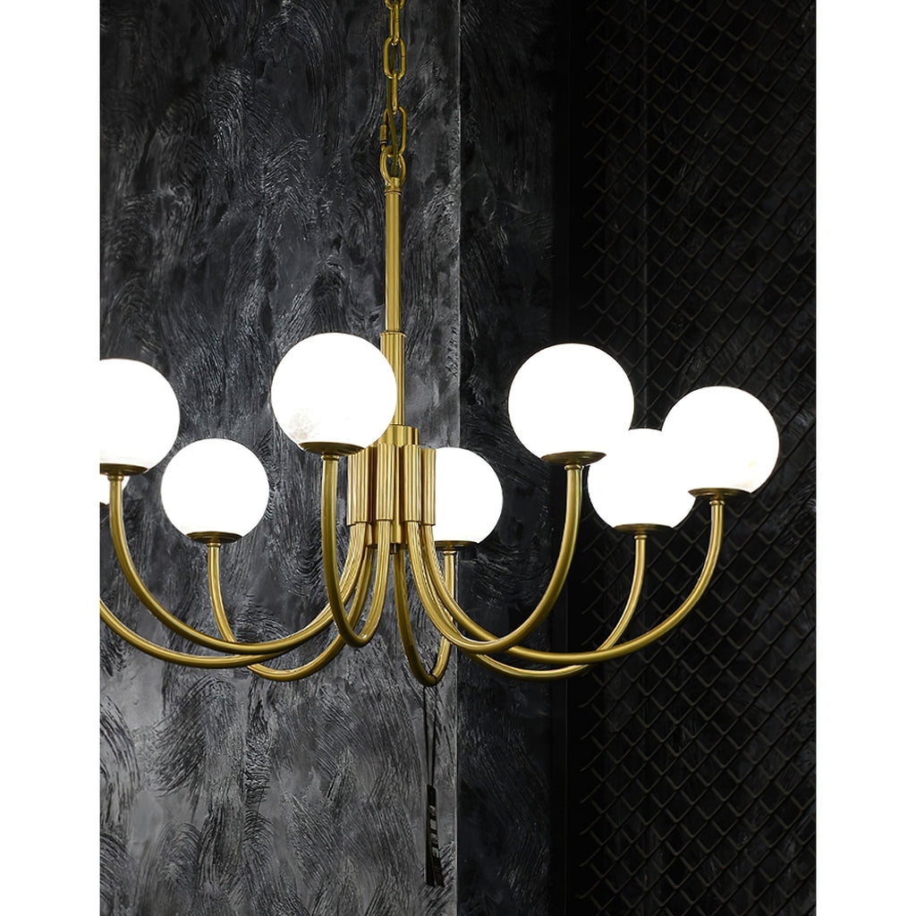 Clérachic angled close view of the lit chandelier in a dark showroom corner with textured black walls