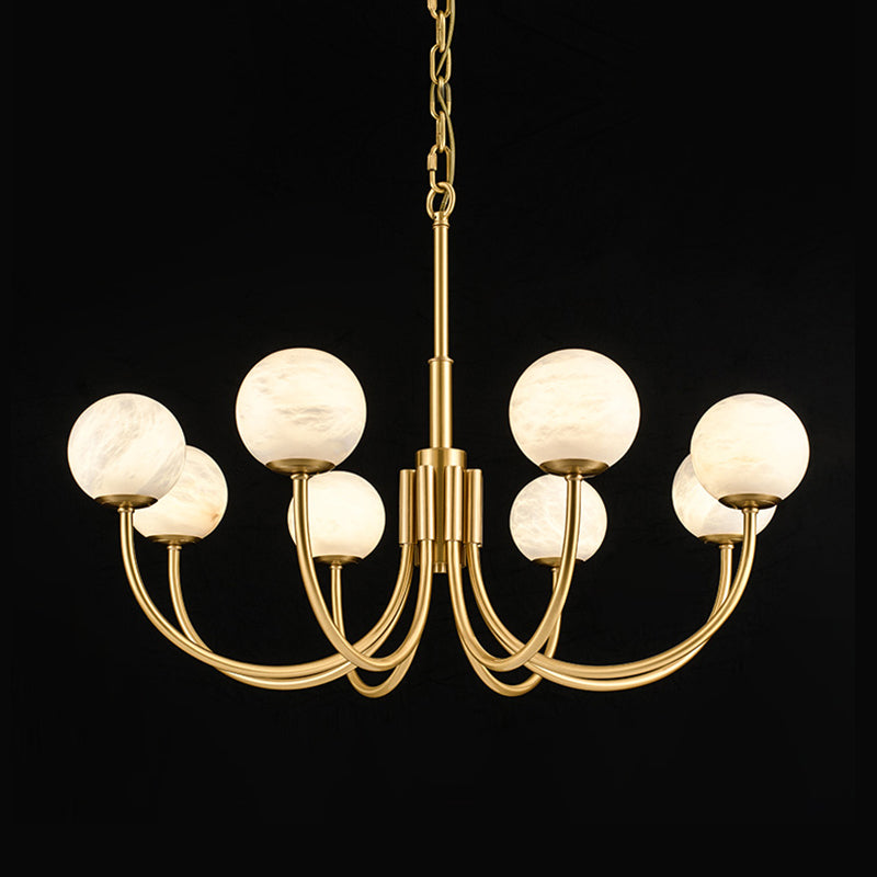 Clérachic studio shot on black with globes unlit, showing the full sweep of the brass arms and chain